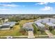 Beautiful home with a well-maintained lawn and a picturesque lake view in a peaceful neighborhood at 5720 107Th E Ter, Parrish, FL 34219