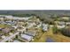 Panoramic aerial view of houses backing on to a body of water in a well-established neighborhood at 5720 107Th E Ter, Parrish, FL 34219