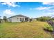 Spacious backyard features a well-maintained lawn and a screened lanai at 5720 107Th E Ter, Parrish, FL 34219
