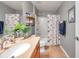 Neutral bathroom featuring a shower-tub combination and floating shelves with a tiled floor at 5720 107Th E Ter, Parrish, FL 34219
