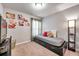 Cozy bedroom featuring a daybed near the window, complemented by carpeted floors and neutral walls at 5720 107Th E Ter, Parrish, FL 34219