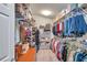 Large walk-in closet offers ample storage space with shelving and hanging racks at 5720 107Th E Ter, Parrish, FL 34219