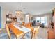 Spacious dining and office area with tile floors, a modern light fixture, and ample natural light at 5720 107Th E Ter, Parrish, FL 34219