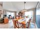 Inviting dining and office area, illuminated by natural light, with tile flooring and a modern light fixture at 5720 107Th E Ter, Parrish, FL 34219
