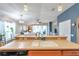 View of eat-in kitchen featuring a double sink, wooden cabinets, and natural light at 5720 107Th E Ter, Parrish, FL 34219