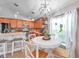 Eat-in kitchen features stylish pendant lighting, stainless appliances, and breakfast bar seating at 5720 107Th E Ter, Parrish, FL 34219