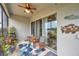 The screened lanai has views of the pond, seating, and access to the backyard at 5720 107Th E Ter, Parrish, FL 34219