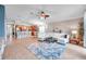 Open-concept space featuring a large living room that connects to a spacious kitchen with an island at 5720 107Th E Ter, Parrish, FL 34219