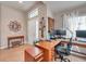 Comfortable home office area with tile floors, natural light, and tasteful decor, perfect for productivity at 5720 107Th E Ter, Parrish, FL 34219