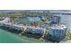 Beautiful aerial view of waterfront condos and lush landscaping, highlighting the tranquil lake and fountain at 6093 Bahia Del Mar Cir # 375, St Petersburg, FL 33715