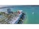 Serene aerial view capturing waterfront condos with pool, palm trees, and waterfront access, offering resort-style living at 6093 Bahia Del Mar Cir # 375, St Petersburg, FL 33715