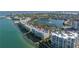 Breathtaking aerial view of waterfront condos showcasing the community's ideal coastal living with stunning water views at 6093 Bahia Del Mar Cir # 375, St Petersburg, FL 33715