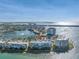 Expansive aerial view of waterfront condos with tranquil lake and ocean, offering scenic views and a serene lifestyle at 6093 Bahia Del Mar Cir # 375, St Petersburg, FL 33715