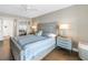 Bedroom with queen-sized bed, stylish side tables, and a ceiling fan, providing a relaxing space at 6093 Bahia Del Mar Cir # 375, St Petersburg, FL 33715