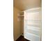 White closet with shelving and hanging rack offers ample storage in this lovely home at 6093 Bahia Del Mar Cir # 375, St Petersburg, FL 33715