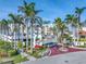 Welcoming entrance to the complex with manicured landscaping, mature palms and red brick roadway at 6093 Bahia Del Mar Cir # 375, St Petersburg, FL 33715