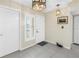 Well-lit entryway with light fixtures and neutral walls, complemented by a decorative duck at 6093 Bahia Del Mar Cir # 375, St Petersburg, FL 33715