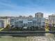 Exterior view of waterfront condos with balconies overlooking the water, showcasing the picturesque setting and waterfront access at 6093 Bahia Del Mar Cir # 375, St Petersburg, FL 33715