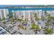 Inviting exterior view of waterfront condos, showcasing meticulous landscaping, parking and lush palm trees at 6093 Bahia Del Mar Cir # 375, St Petersburg, FL 33715