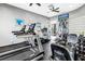 Well-equipped fitness center with modern treadmills, exercise machines, and a ceiling fan at 6093 Bahia Del Mar Cir # 375, St Petersburg, FL 33715