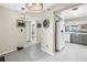 Hallway with tile flooring and neutral walls leading to bathroom and eat-in kitchen at 6093 Bahia Del Mar Cir # 375, St Petersburg, FL 33715