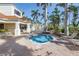 Relaxing community hot tub surrounded by brick pavers and swaying palm trees at 6093 Bahia Del Mar Cir # 375, St Petersburg, FL 33715