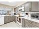 Modern kitchen with stainless steel appliances, white countertops and eat-in space at 6093 Bahia Del Mar Cir # 375, St Petersburg, FL 33715