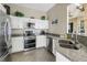 Well-equipped kitchen features stainless steel appliances and granite countertops at 6093 Bahia Del Mar Cir # 375, St Petersburg, FL 33715