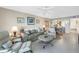 Open living space with comfortable seating, tile flooring, and a view into the dining area and kitchen at 6093 Bahia Del Mar Cir # 375, St Petersburg, FL 33715