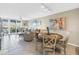 Inviting living area with water views, a dining area, comfortable seating, and tile flooring at 6093 Bahia Del Mar Cir # 375, St Petersburg, FL 33715