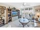 This living room features neutral decor and a sliding glass door leading to an outdoor balcony with a beautiful water view at 6093 Bahia Del Mar Cir # 375, St Petersburg, FL 33715