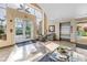 Bright lobby area featuring an elevator, tiled floors, seating, and natural light from large windows at 6093 Bahia Del Mar Cir # 375, St Petersburg, FL 33715