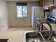 Kitchen with tile floors, stainless steel sink, white refrigerator and flat-top stove at 138 Cypress Ct # 138, Oldsmar, FL 34677