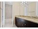 Well-lit bathroom featuring dual sinks, granite countertops, and a shower-tub combo at 28475 Marsciano Ln, Wesley Chapel, FL 33543