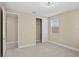 Neutral bedroom featuring neutral carpet, a ceiling fan, a window, and a closet at 28475 Marsciano Ln, Wesley Chapel, FL 33543