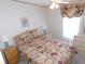 Well-lit bedroom with neutral walls, a ceiling fan, and matching bedside tables at 36819 Kiowa Ave, Zephyrhills, FL 33542