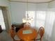Charming dining room with a wood table, chairs, and a classic chandelier at 36819 Kiowa Ave, Zephyrhills, FL 33542