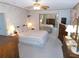 Relaxing main bedroom with a mirrored closet and dresser at 36819 Kiowa Ave, Zephyrhills, FL 33542