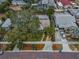 Bird's eye view of the property showing the house, landscaping, and surrounding neighborhood from above at 546 Orangewood Dr, Dunedin, FL 34698