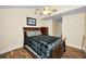 Cozy bedroom featuring wood-look floors, a ceiling fan, and neutral paint at 546 Orangewood Dr, Dunedin, FL 34698