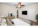 Bedroom featuring a ceiling fan, TV, and an access door at 546 Orangewood Dr, Dunedin, FL 34698