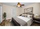 Bright bedroom with hardwood floors, ceiling fan, and ample natural light at 546 Orangewood Dr, Dunedin, FL 34698