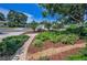 Beautiful landscaping with lush greenery and flowers lining a walkway in the front yard at 546 Orangewood Dr, Dunedin, FL 34698