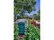 Quaint home with a classic mailbox, brick accents, and vibrant landscaping in the well-maintained front yard at 546 Orangewood Dr, Dunedin, FL 34698