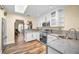 Modern kitchen with white cabinetry, stainless steel appliances, and a bright, open feel at 546 Orangewood Dr, Dunedin, FL 34698