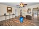 Charming living room with wood-look floors, decorative accents, and an open layout at 546 Orangewood Dr, Dunedin, FL 34698