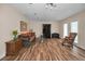 Spacious living room with hardwood floors and natural light coming in from windows at 546 Orangewood Dr, Dunedin, FL 34698