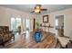 Bright and inviting living room with decorative accents, lots of natural light, and wood look flooring at 546 Orangewood Dr, Dunedin, FL 34698