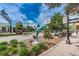 Street view of downtown Dunedin, FL, showcasing public art and landscaped sidewalks, under a bright blue sky at 546 Orangewood Dr, Dunedin, FL 34698