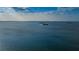 Expansive waterfront view with distant islands and sunlit skies on a serene day at 546 Orangewood Dr, Dunedin, FL 34698